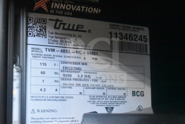 Label of True GDM-41SL-60EM-LD cooler showing model details, refrigerant type R290, 115 volts, and phase specifications.