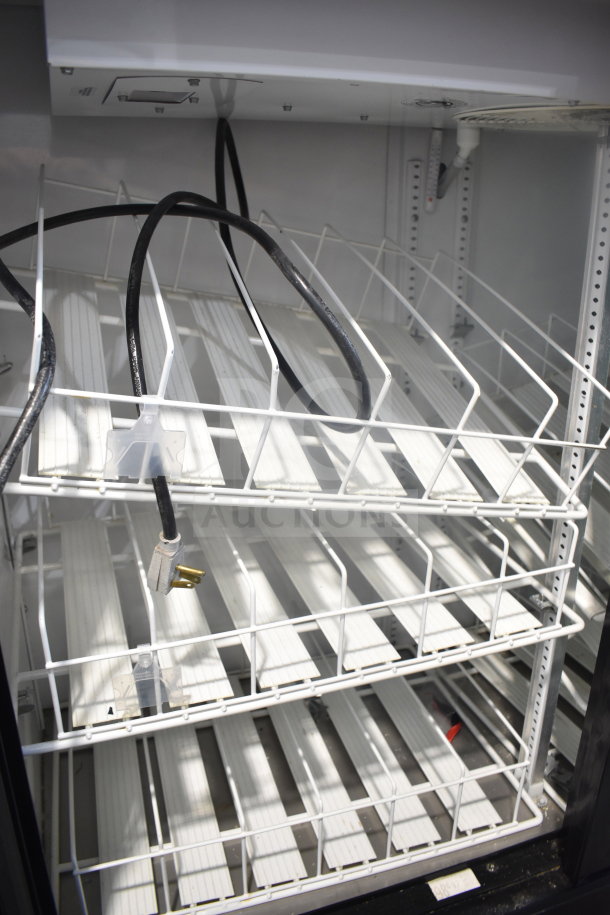 2016 True GDM-41SL-48-HC-LD cooler interior with adjustable shelves and wiring. Commercial grade, good condition.