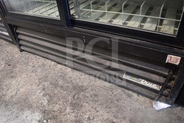2016 True GDM-41SL-48-HC-LD cooler, 2-door merchandiser, 115V, with visible True logo, in used condition.