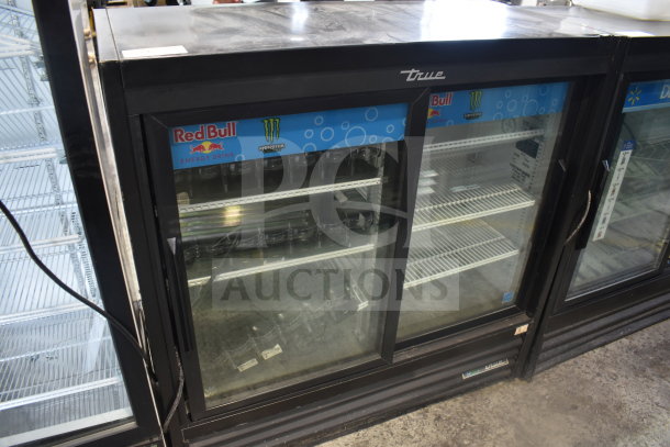2019 True GDM-41SL-48-HC-LD 2 Door Reach In Cooler Merchandiser with Red Bull and Monster branding, in good condition.