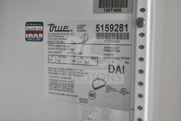 True GDM-41SL-54 cooler label showing model, voltage 115V, refrigerant R134A, and NSF certification.