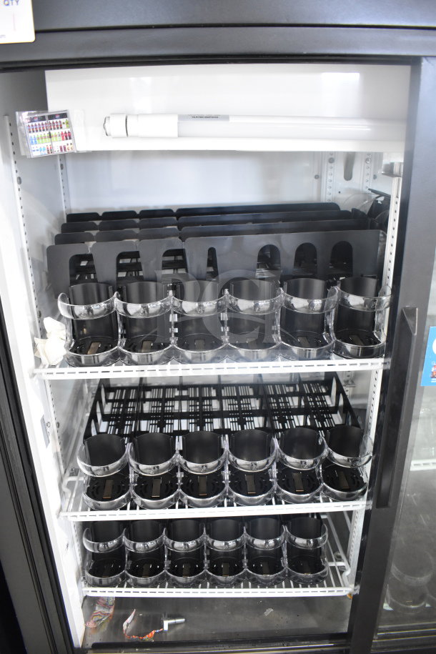 True GDM-41SL-54 2 Door Reach In Cooler Merchandiser, 115 Volts, 1 Phase. Shelves with organized black dividers.