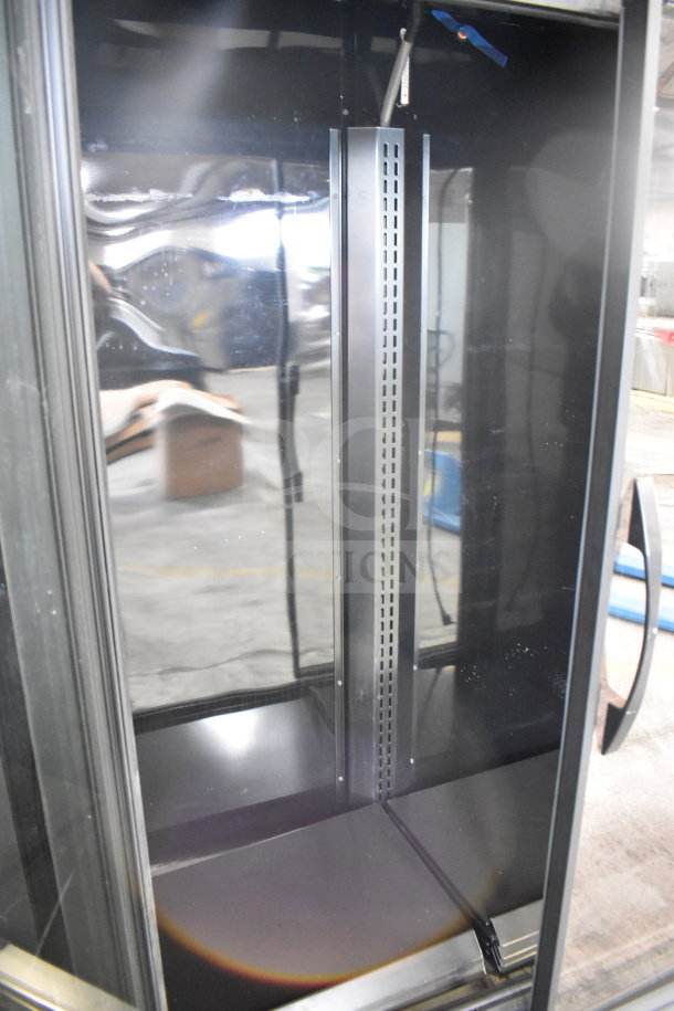 2022 True TVM-48SL-HC cooler, 2-door, reach-in design, black interior, excellent condition, 115 volts, 1 phase.
