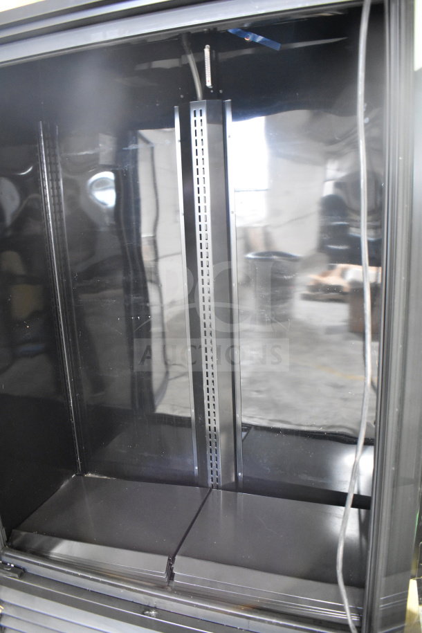 2022 True TVM-48SL-HC 2 Door Reach In Cooler Merchandiser, 115 Volts, 1 Phase, black interior, unused condition.