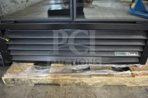 2022 True TVM-48SL-HC 2 Door Reach-In Cooler on palette. Black exterior vent, brand label visible. 115 Volts, 1 Phase.