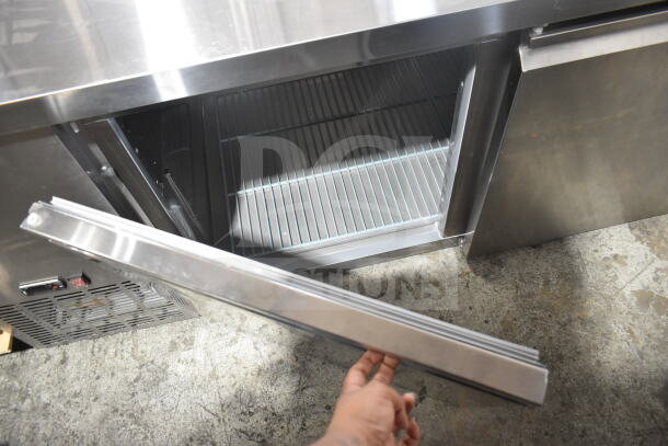Brand new Avantco 178SSUD3R commercial 3-door undercounter cooler, 115V, 1 phase, with open door, scratch and dent condition.