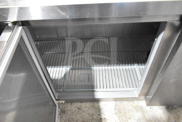 Brand new Avantco 178SSUD3R 3-door undercounter cooler, 115V, 1 phase, open door view, shelves visible, stainless steel.
