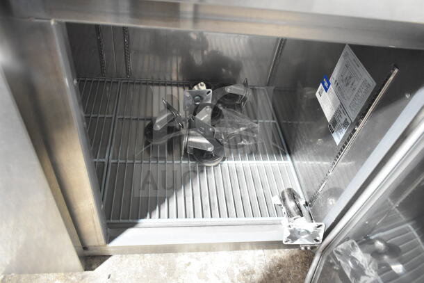 Avantco 178SSUD3R commercial cooler, brand new with scratch and dent, includes casters, 115V, 1 phase, interior view.