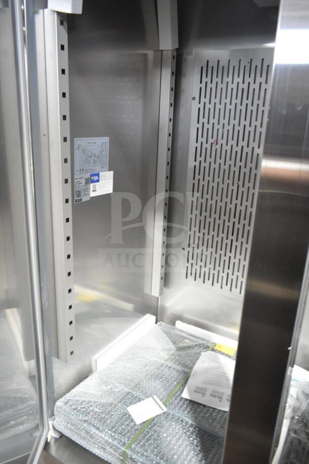 Brand new Avantco 178SS3FHC 3 door reach-in freezer, 115V, with minor scratches and dents. Interior view with labels.