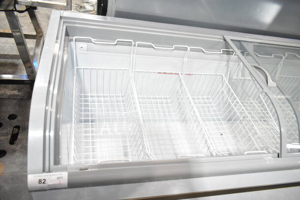 Brand new KoolMore KM-ISCF-78MD manual defrost chest freezer, 19 cu. ft., on commercial casters. Visible scratch and dent.