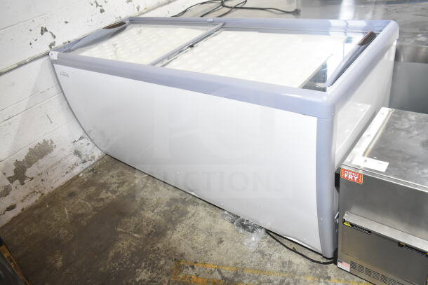 Brand new KoolMore KM-ICD-71SD ice cream dipping cabinet, 12 tubs, sliding glass doors, 20 cu. ft., 115 volts, minor dents visible.