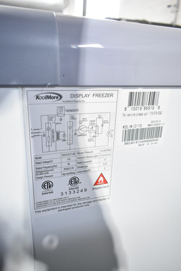 BRAND NEW SCRATCH AND DENT KoolMore KM-ICD-71SD 12-tub ice cream dipping cabinet with sliding glass door, 20 cu. ft., 115V. Labels display specs and barcode.