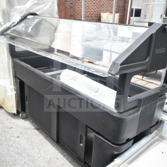 Cambro Black Poly Salad Bar with wheels, clear sneeze guard, and multiple compartments. Good condition, ideal for buffet use.