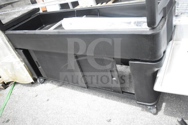Cambro black poly salad bar on wheels, featuring a durable polycarbonate structure and sliding doors. Excellent condition.