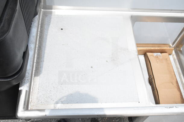 Alt text: Regency 600S21824224 commercial sink; two bays, dual drain boards, new condition with scratches; includes packaging.