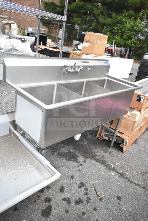 Commercial 3 bay stainless steel sink with faucet and handles, used condition, suitable for industrial or restaurant use.