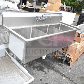 Commercial 3 bay stainless steel sink with faucet and handles, used condition, suitable for industrial or restaurant use.