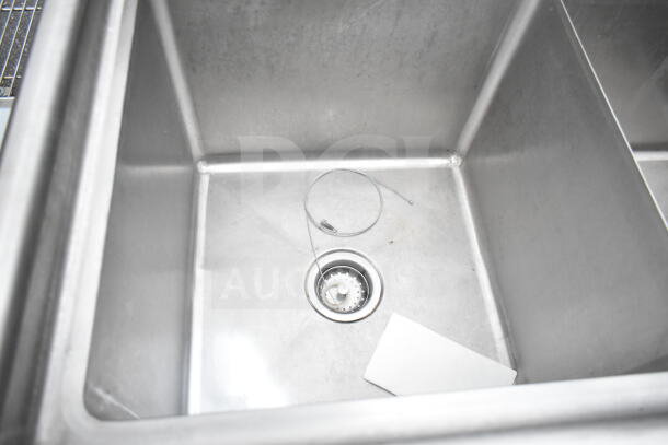 Commercial 3 bay stainless steel sink with faucet and handles, clean with visible drain, ideal for industrial kitchens.