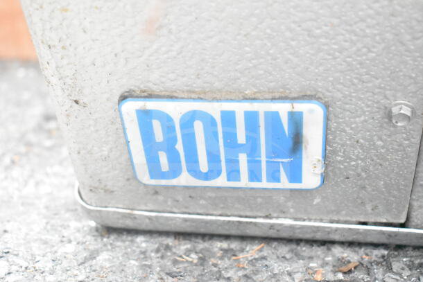 Bohn ADT208AK Evaporator Fan, 115V, 1 Phase, with visible Bohn logo on metal casing. Signs of outdoor wear.