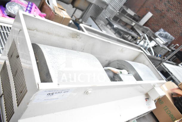 Dayton 6E825B Air Curtain Cabinet, white metal casing, industrial design, visible fan components, used condition.