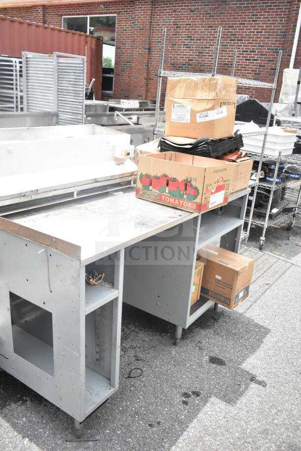 Duke Subway sandwich make line piece with boxes on top, including baking pan liners, shown outdoors.