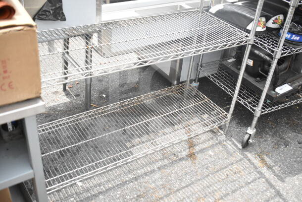 Chrome finish 4-tier wire shelving unit in good condition. Buyer must dismantle; consider freight charges.