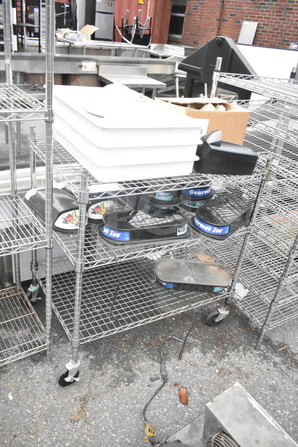 Chrome 3-tier wire shelving unit on commercial casters with hopper lids and dough bins. Buyer must dismantle.