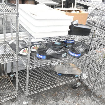Chrome 3-tier wire shelving unit on commercial casters with hopper lids and dough bins. Buyer must dismantle.