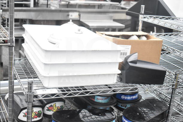 Chrome finish 3-tier wire shelving unit on casters, includes hopper lids and dough bins. Buyer must dismantle.