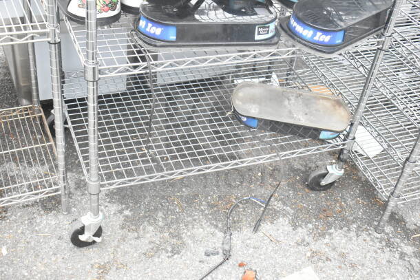 Chrome 3-tier wire shelving unit with commercial casters, includes hopper lids and dough bins. Buyer must dismantle.