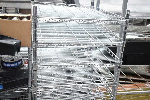 Chrome finish 8 tier wire shelving unit in good condition. Buyer must dismantle. Consider freight charges.