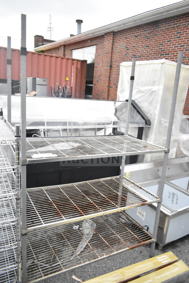Gray 3-Tier Wire Shelving Unit, sturdy construction, minimal wear. Buyer must dismantle. Ideal for storage use.