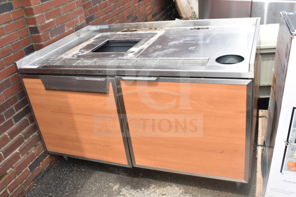 Duke SUBBD-60-LM Commercial Soda Station, stainless steel top, wood paneling, used condition, visible labeling, outdoor setting.
