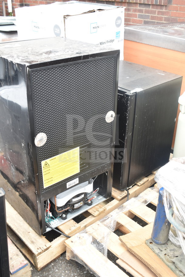 Four mini coolers, brands include MainStays and Galanz, shown on pallets. Used condition, 115V, 1 phase each.