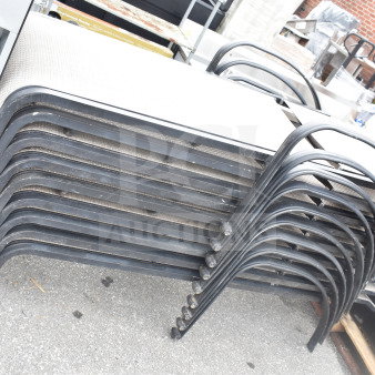 Stack of nine outdoor chaise lounge chairs with black metal frames, seen in used condition, ideal for bulk purchase.