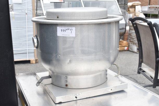 Commercial rooftop mushroom exhaust fan in silver metal, with visible label indicating auction information.