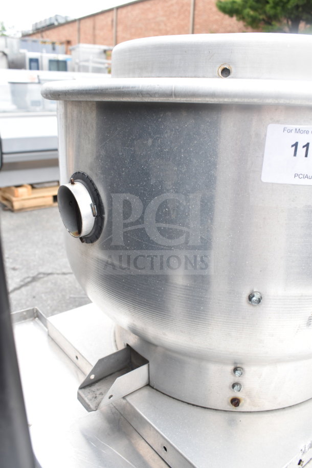 Commercial rooftop mushroom exhaust fan, metal construction, with visible mounting bracket. Appears in good condition.