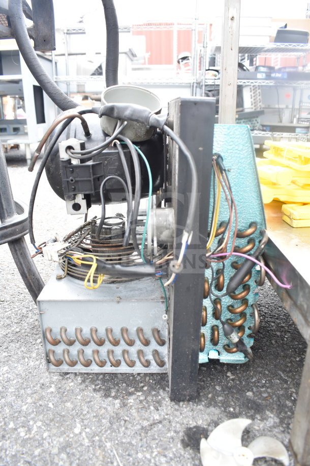 Embraco FFI 12HBX Compressor, 220 Volts, showing exterior components and wiring, in used condition.