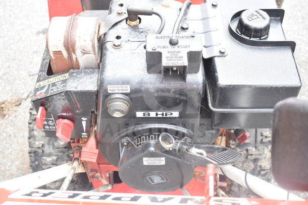 Snapper 8262 Snow Thrower, 8 HP engine, visible controls, rust on exhaust, used condition, electric starter.
