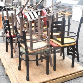 18 various dining height chairs with colorful seats on a pallet, mixed wood finishes, good used condition.
