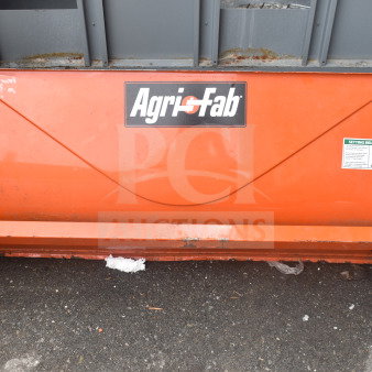 Agri-Fab lawn mower brushing attachment, orange, with brand logo visible. Includes setting brush height instructions. Good condition.