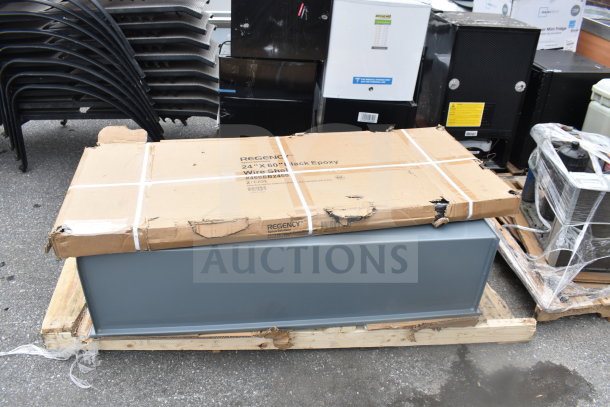 BRAND NEW SCRATCH AND DENT Regency 460EB2460 24" x 60" NSF Black Epoxy Wire Shelf in damaged packaging.