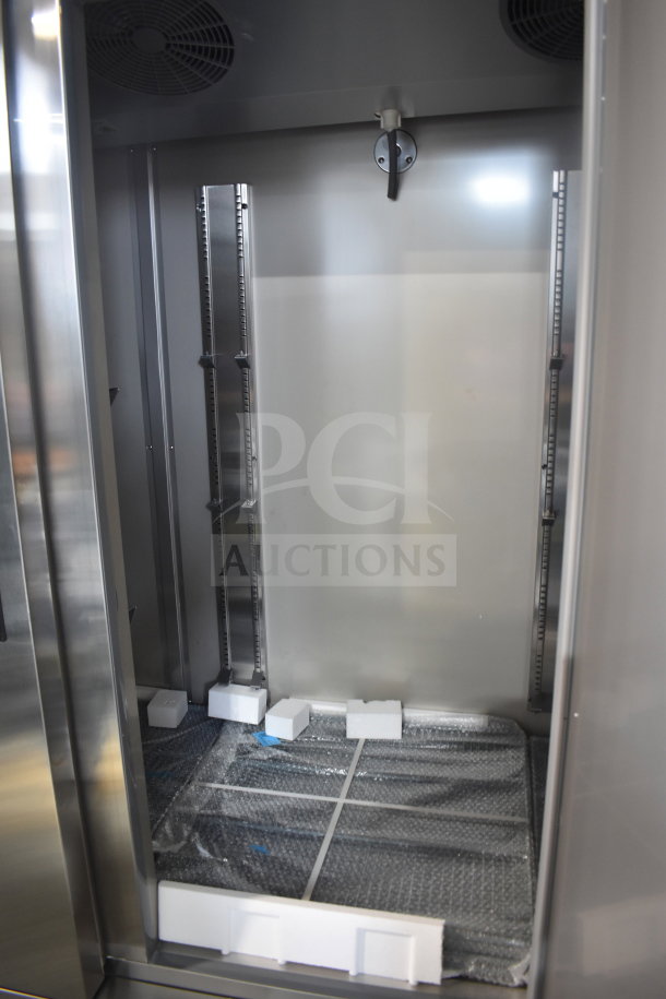 Brand new 2025 KoolMore RIR-3D-SS commercial refrigerator, 72 cu. ft., three doors, interior view showing shelving tracks.