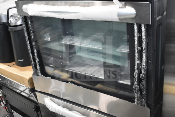 BRAND NEW 2025 KoolMore KM-WO30D-SS 5 cu. ft. stainless-steel convection wall oven with visible glass damage.