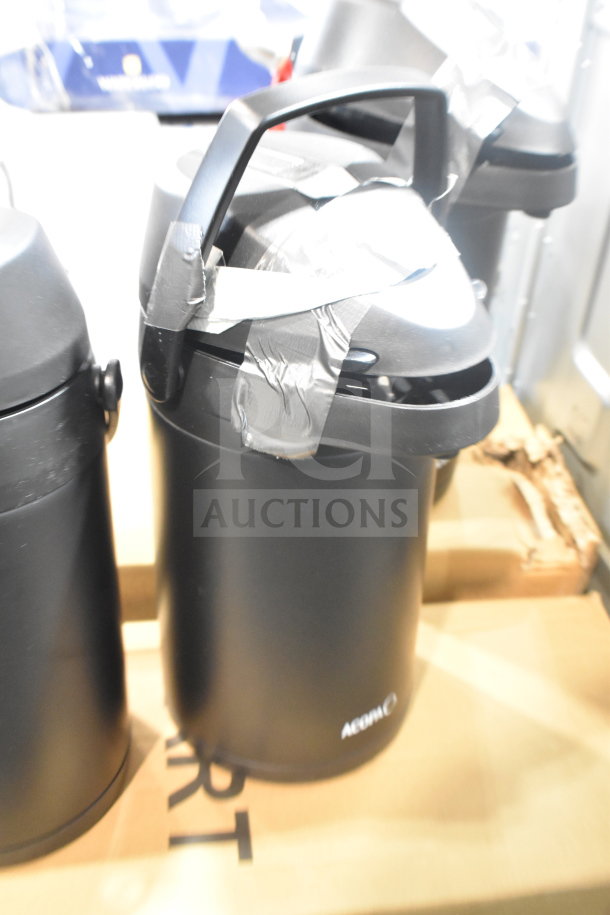 Black air pot, brand Aonbei, new condition with visible scratches and dents, taped around lid, on cardboard box.