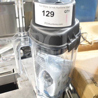 Brand new Blendtec pitcher with minor scratches, clear plastic, secure black lid, model details visible. Tags indicate sale.