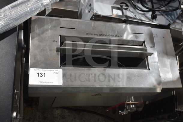 Brand new Avantco CPBTR66B compact vertical bun toaster, 208 volts, with minor scratches and dents. Labels indicate "DO NOT REMOVE COVER DURING USE."