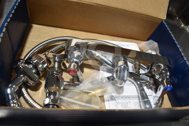 BRAND NEW SCRATCH AND DENT T&S B-1157 wall mounted faucet with spray valve, 8" centers, 8" swing nozzle in box.