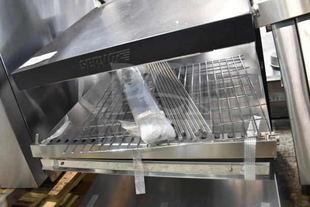 BRAND NEW ServIt 423OAM65D 24" slanted 2-shelf countertop heated display merchandiser. 120V, 1 phase. Scratch and dent condition.