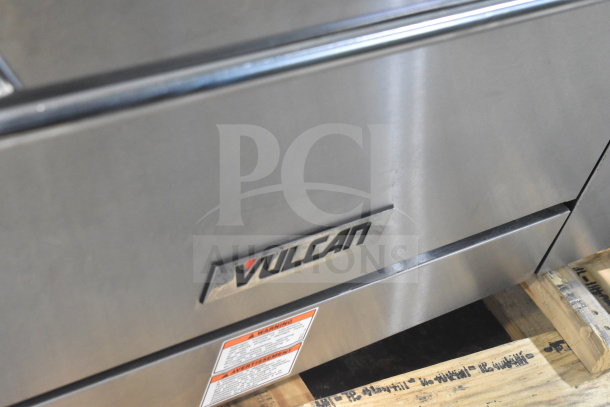 Brand new Vulcan 36C-6BP range, 6 burners, 36" size, 215,000 BTU, convection oven base, scratch and dent, label visible.